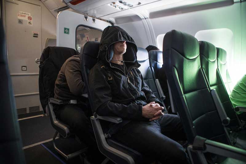 Person wearing Neckpacker in an airplane