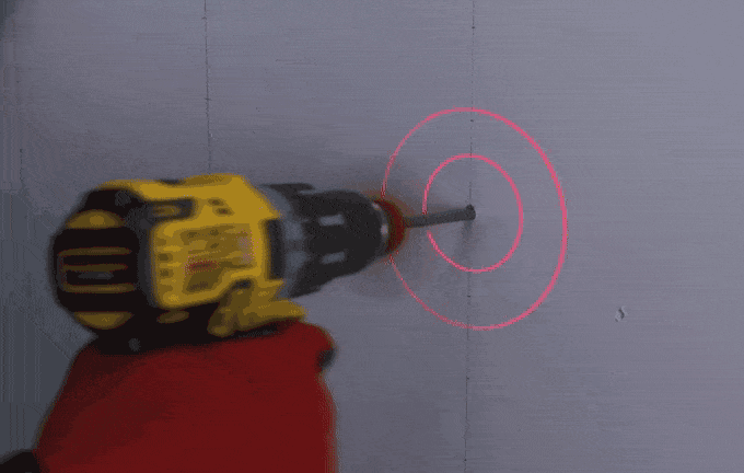 BullseyeBore Core projecting a laser guide while drilling into a wall