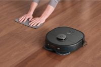 Person wiping floor as Eufy X10 Pro Omni mops