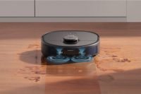 Eufy X10 Pro Omni cleaning spilled liquid on hardwood floor.