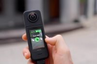 person taking a 360 photo with ACFLOW Snap