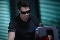 Man using the Longer Nano laser engraver with safety glasses