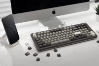 Modern97 keyboard in grey on a desk with an iMac and smartphone.
