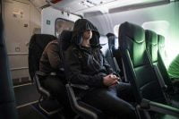 Person wearing Neckpacker on an airplane
