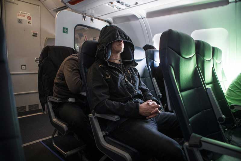 Person wearing Neckpacker on an airplane