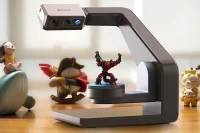 Seal 3D scanner capturing a colorful figurine on a turntable