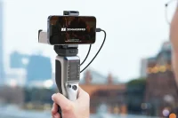 Mobile device mounted on Seal 3D scanner with cityscape background