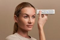 BeamO device used on forehead with neural activity visualization