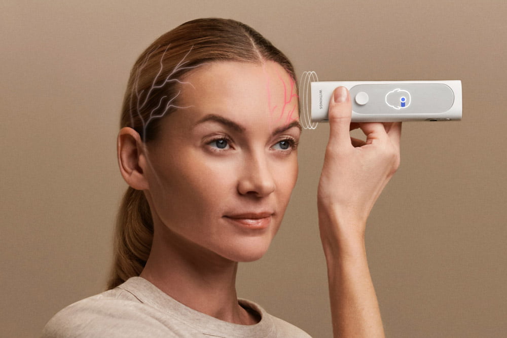 BeamO device used on forehead with neural activity visualization