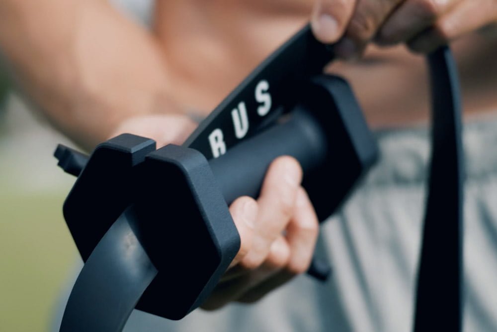 person sliding a resistance bands in GymBars PRO