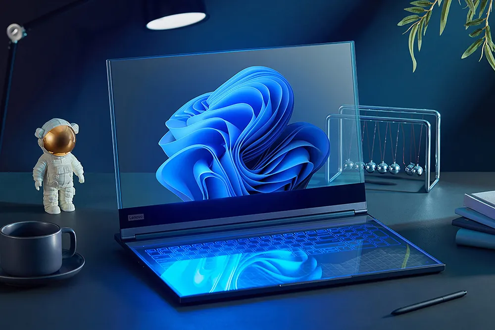 Lenovo ThinkBook Transparent with a blue floral wallpaper, alongside a toy astronaut