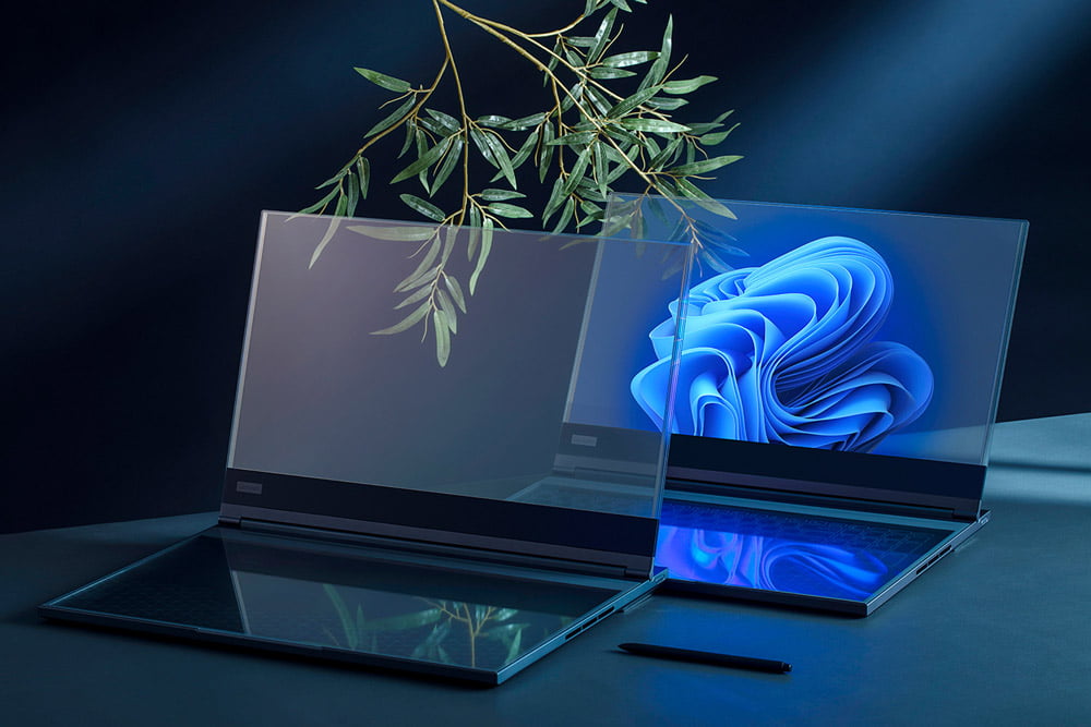 Lenovo ThinkBook Transparent with a blue wallpaper, reflecting on a dark surface