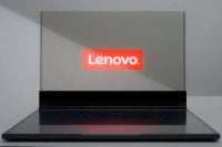 Lenovo ThinkBook Transparent laptop displaying the Lenovo logo on its clear screen