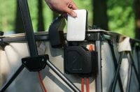 Person putting a battery pack inside Litheli W1 Pro