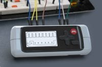 M1 by Monstatek on a lab bench with wires and circuit boards