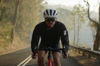Cyclist in a black outfit wearing Minimis Glass