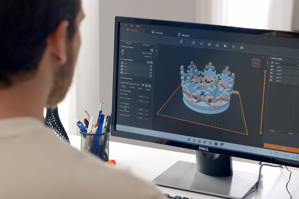 Person using software to prepare a 3D model for printing on Phrozen Arco